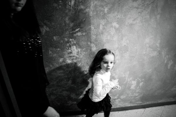 A little girl having fun during the family celebration. One day she will be a bride too.